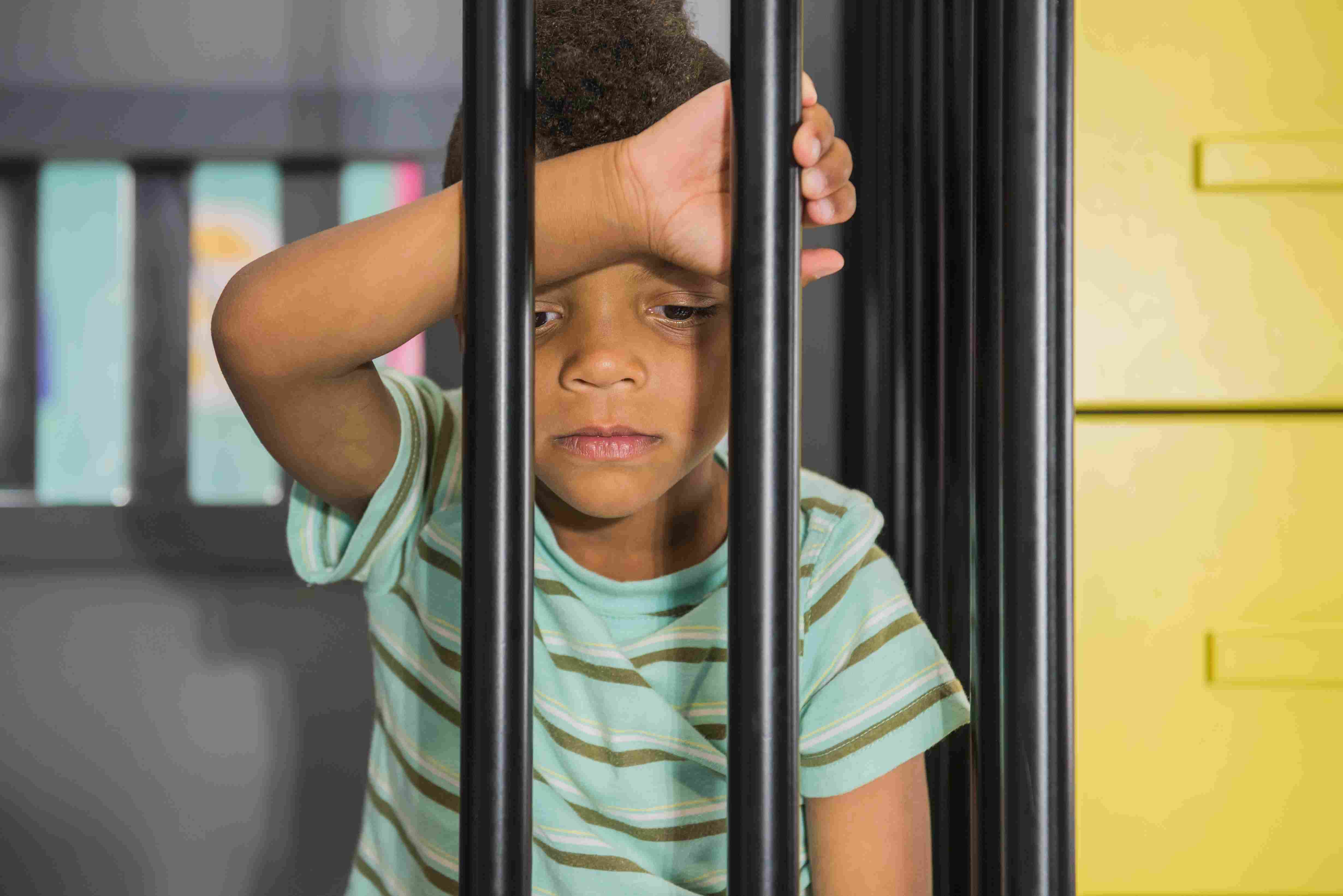 A child behind bars