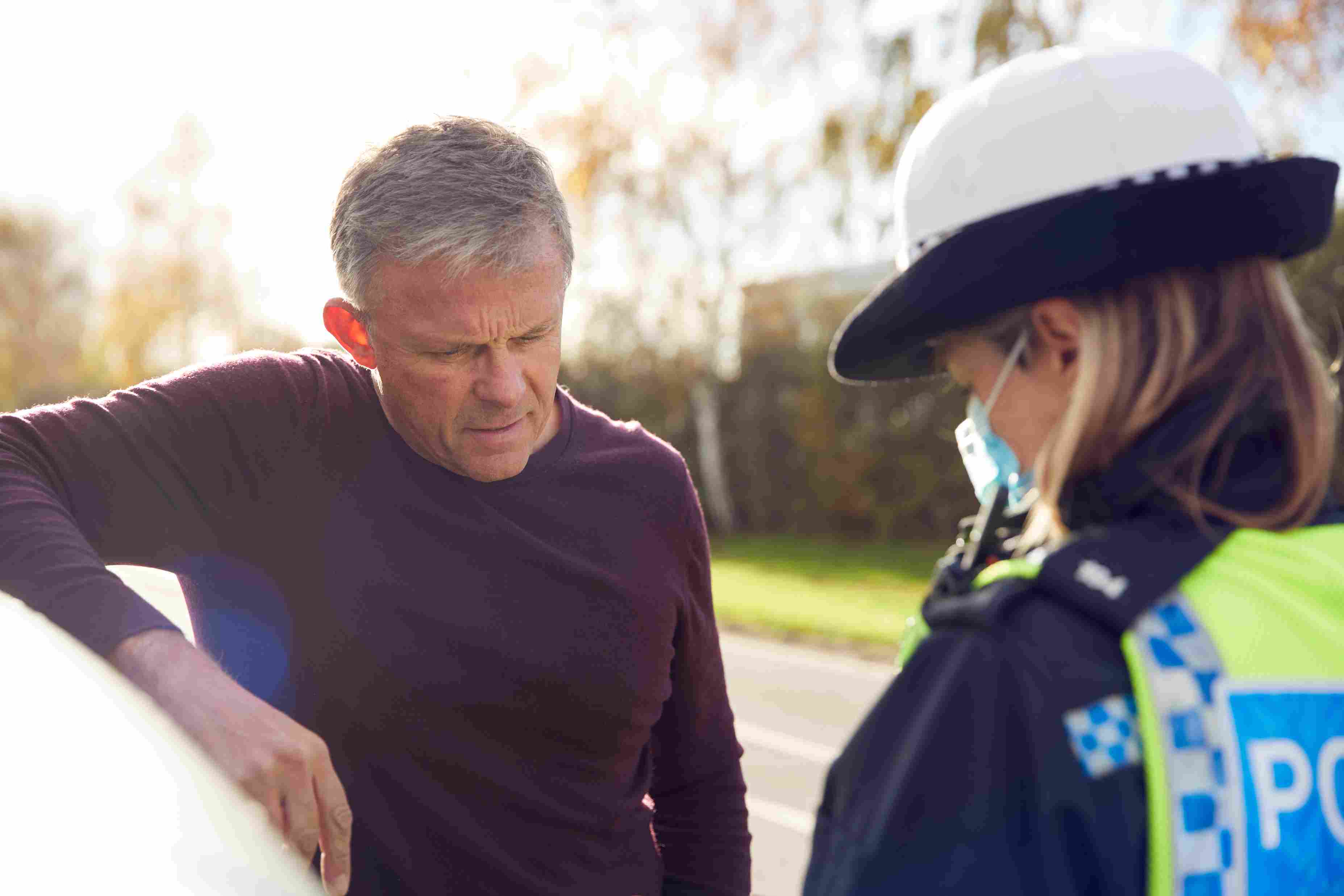 Man talking to a female police officer